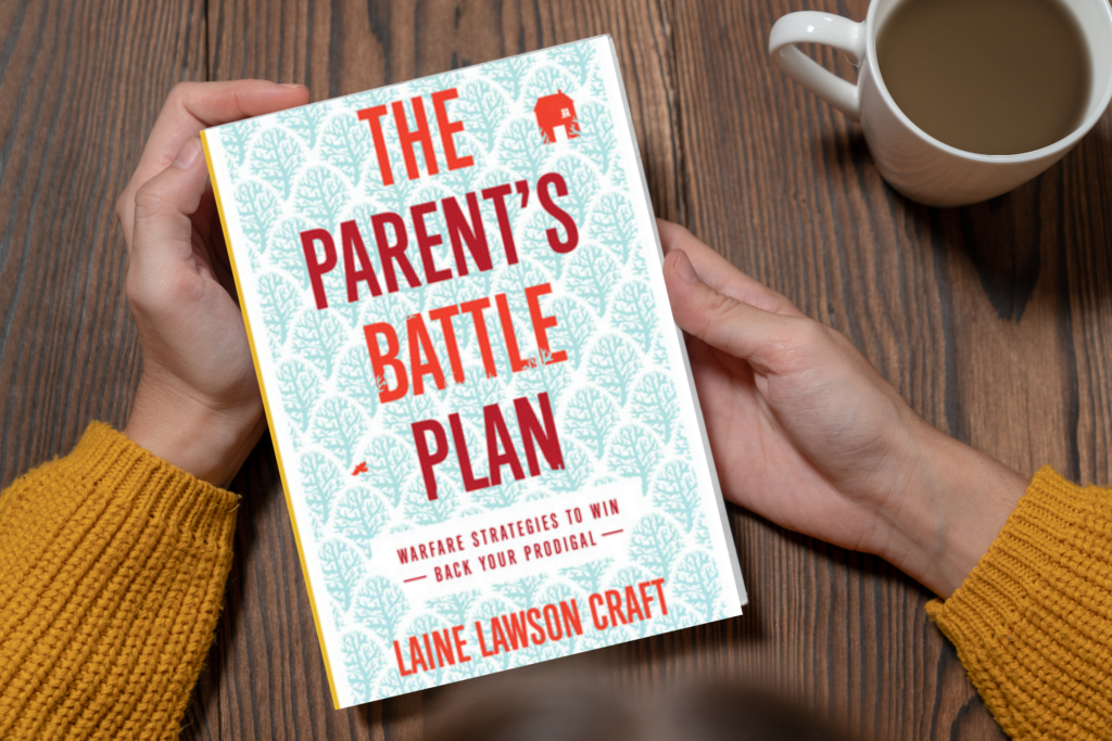 woman's hands holding book - The Parent's Battle Plan