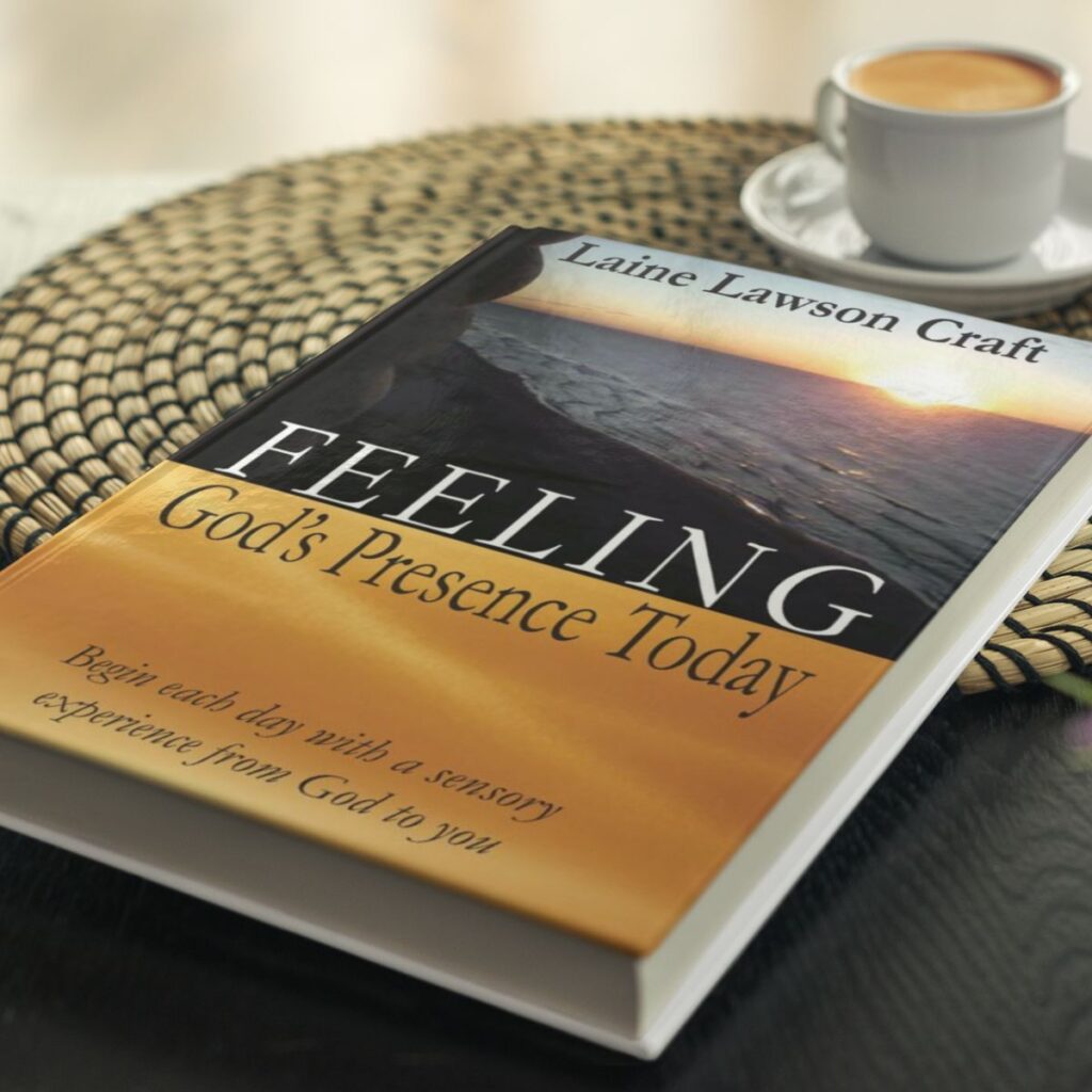 Feeling God's Presence book on table with place mat and coffee cup.
