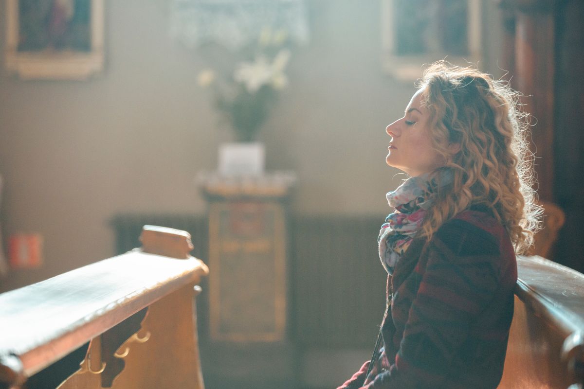 your spiritual transformation showing woman praying in church