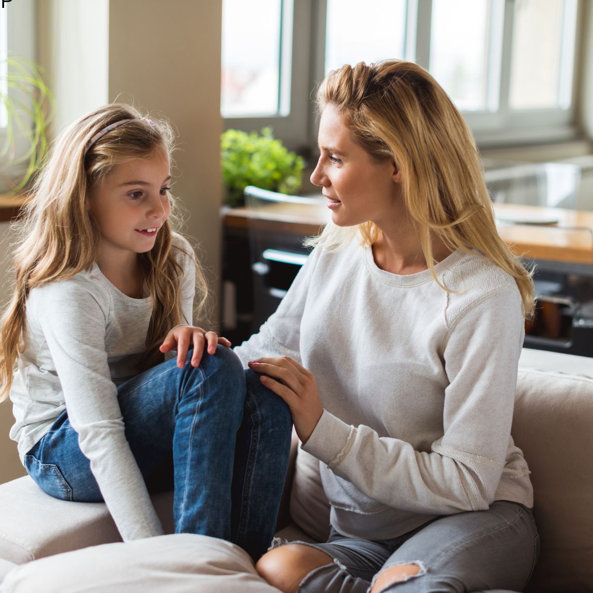 mother talking to pre-teen daughter